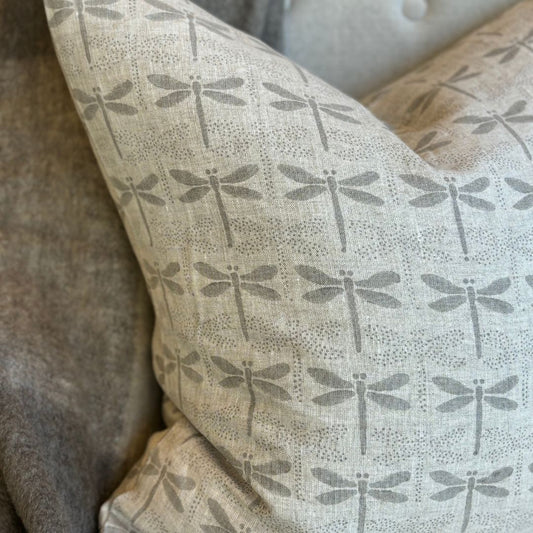 Indulge in the luxury of our Dragon Fly Block Printed Heavy Weight Linen Cushion, featuring a delicate French linen fabric and filled with a soft feather insert measuring 55x55. Its understated light grey tones add an elegant touch to any space. Detail.