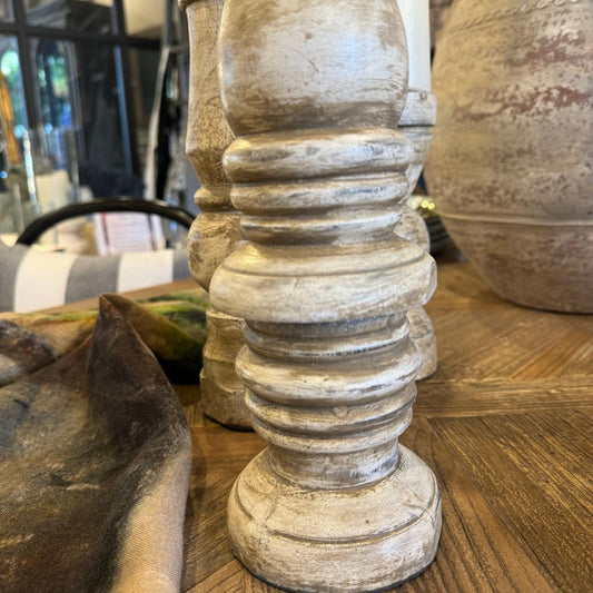 We love the chunky yet elegant Gordes Cream Distressed Teak Candle Holder. Their soft curves and shapes accentuate the beauty of the natural recycled teak that have been gently distressed for vintage appeal. They are substantial enough to work on their own or as a beautiful collection of candle holders on a mantelpiece or a table.