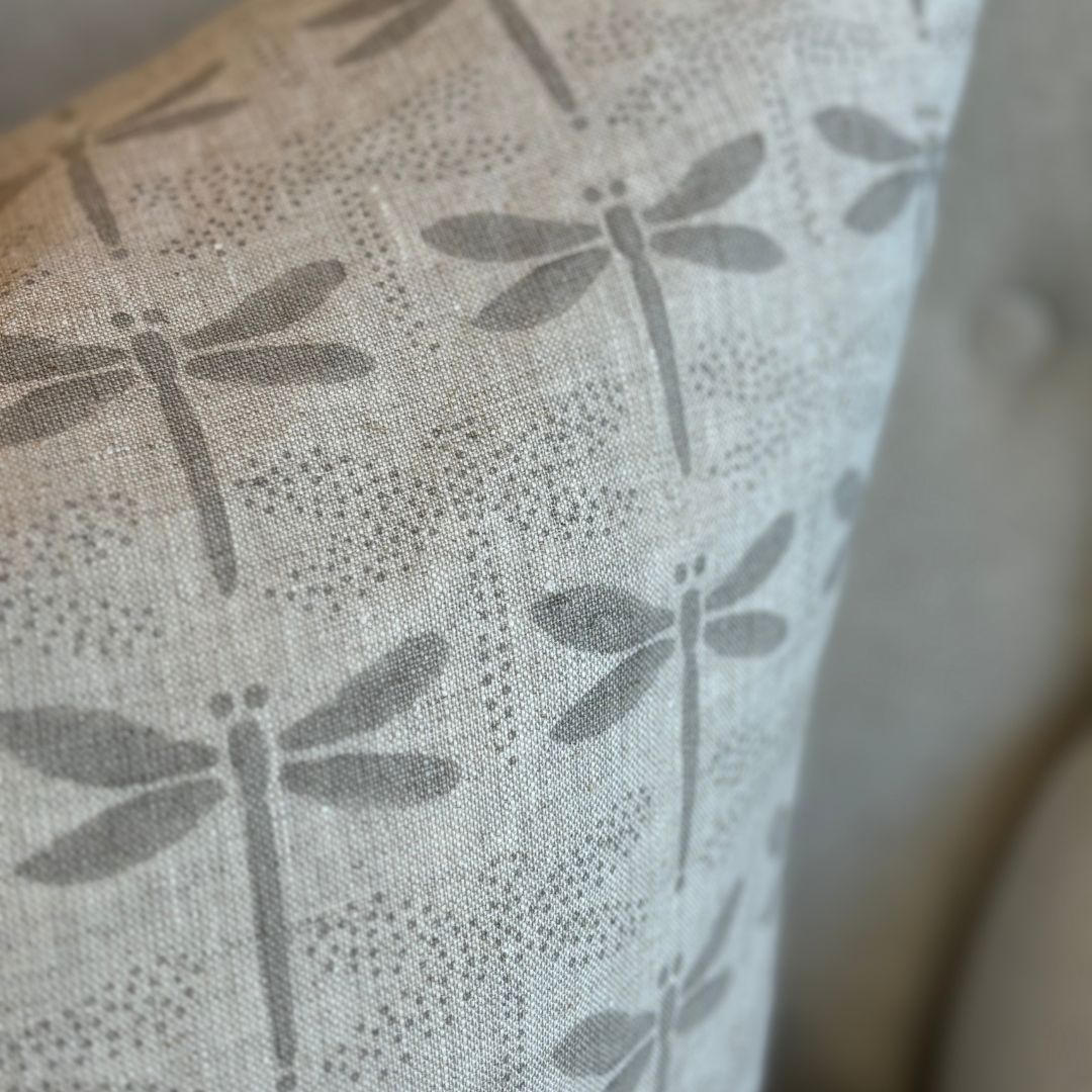 Indulge in the luxury of our Dragon Fly Block Printed Heavy Weight Linen Cushion, featuring a delicate French linen fabric and filled with a soft feather insert measuring 55x55. Its understated light grey tones add an elegant touch to any space. Close.