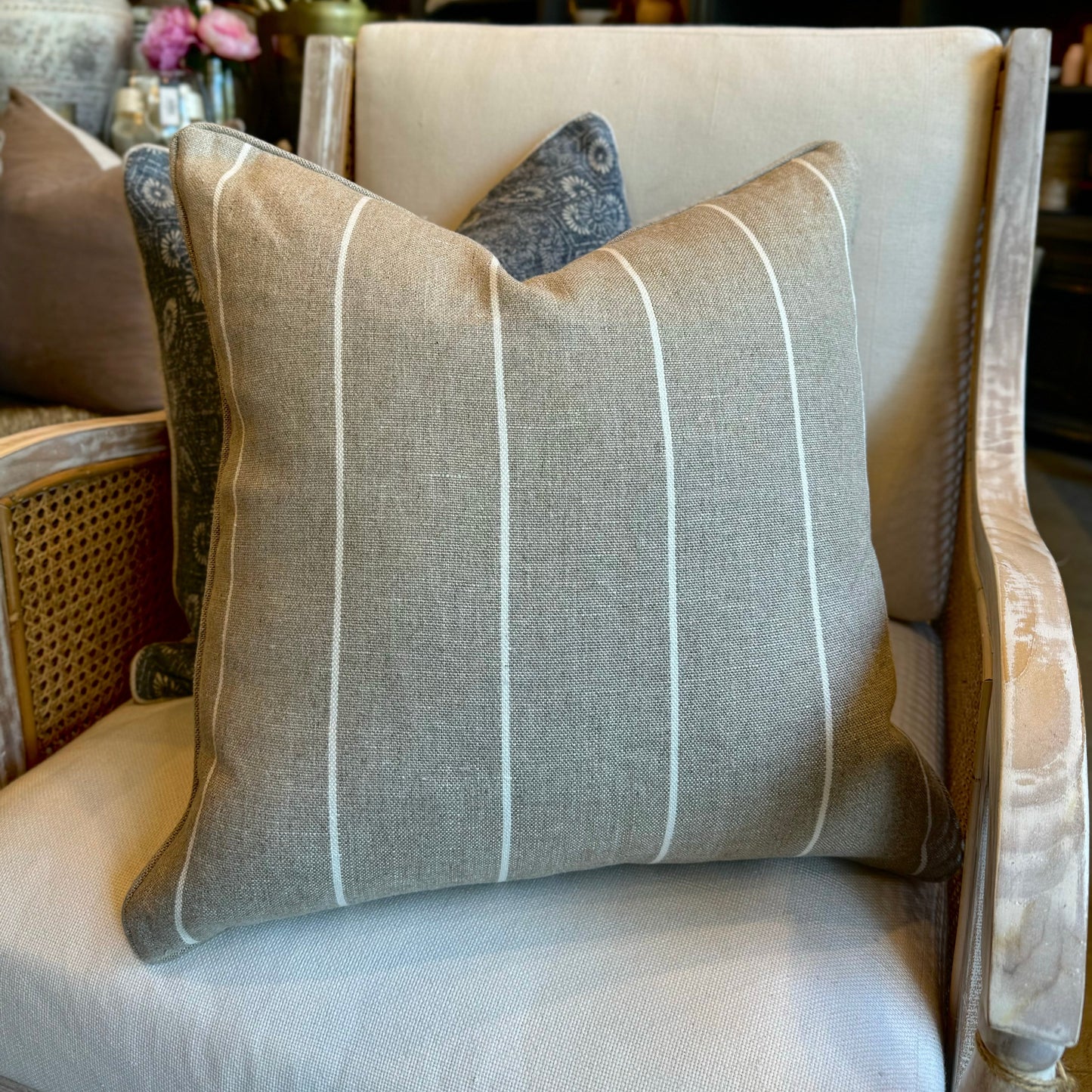 Indulgently fashioned from a luxurious, durable fabric, this exquisite Wortley Narrow Neutral White Stripe Cushion boasts a classic white stripe on a warm neutral background. It's the perfect timeless and graceful accent to elevate any home decor. Includes a luxurious feather insert.