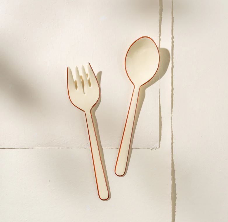 Bring understated elegance to your table with these exquisite handcrafted salad servers from India. Constructed from robust stainless steel and adorned with a refined enamel finish, these servers combine practicality with aesthetic appeal. Perfect for those who believe serving should be as memorable as the meal itself, this set adds a touch of artisanal charm to every dining occasion. Hand-wash to preserve the beautiful craftsmanship that makes these pieces truly special.