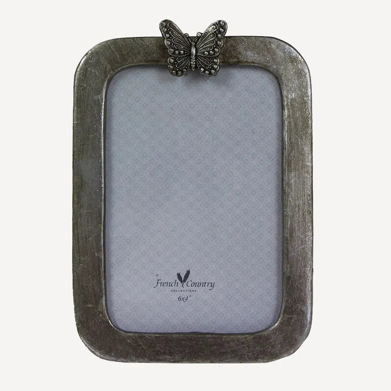 Transform your precious memories into stunning displays with the Butterfly Photo Frame. This frame features an elegant antique silver design with a regal butterfly perched on top, adding a touch of elegance to any room.
Dimensions: 12.5cmL x 1cmW x 17.5cmH