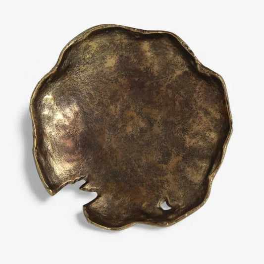 Bronze-colored decorative object on a white background