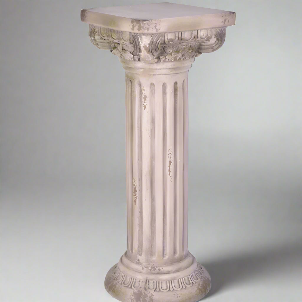 Decorative column-style pedestal on a white background