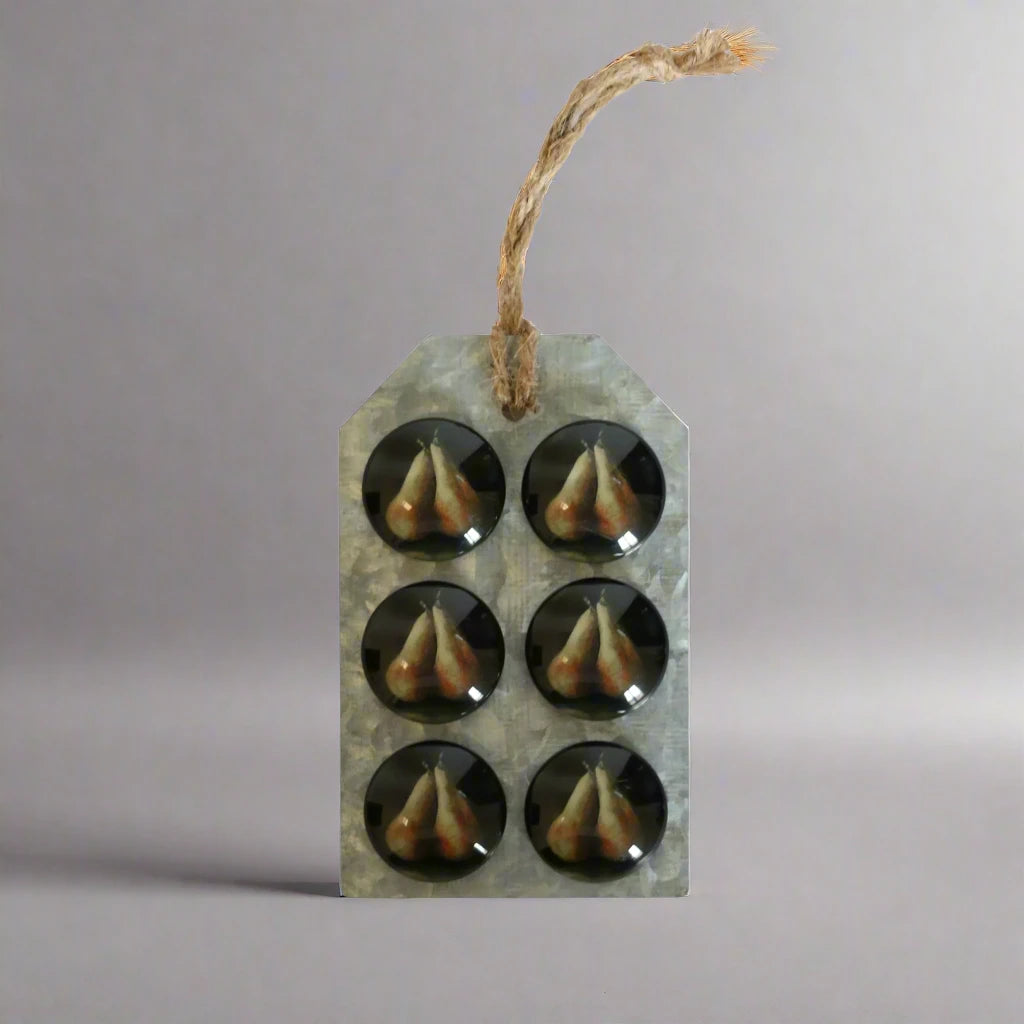 Elevate your kitchen or home office with these lovely glass magnets featuring a charming pear design. Their delicate appearance adds a touch of decoration to any space. Front