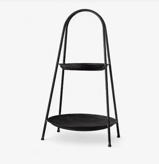 Black metal plant stand with two shelves on a white background