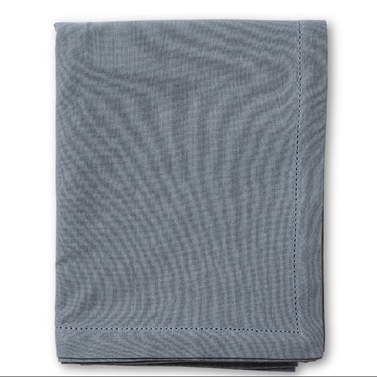 Folded blue textured fabric on a white background