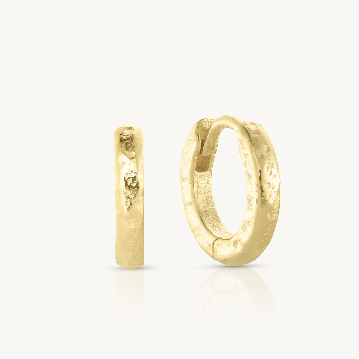 Gold hoop earrings on a white background