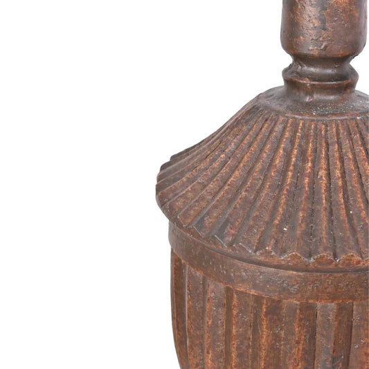close up of bronze urn