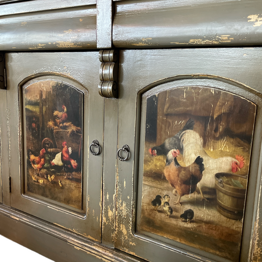 Gifted artisans in Java have crafted this one-of-a-kind furniture piece that boasts a lightly-distressed, aged look with hand-painted chickens. Meticulously carved from mahogany, this exquisite item is certain to be a cherished family heirloom. It features 3 doors and 3 drawers. Detail