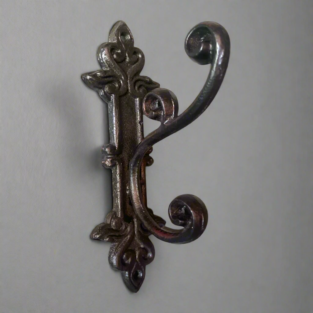 This charming & timeless cast iron hook is perfect in anywhere in the house for additional hanging.