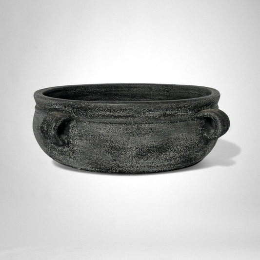 Black stone bowl on a white background