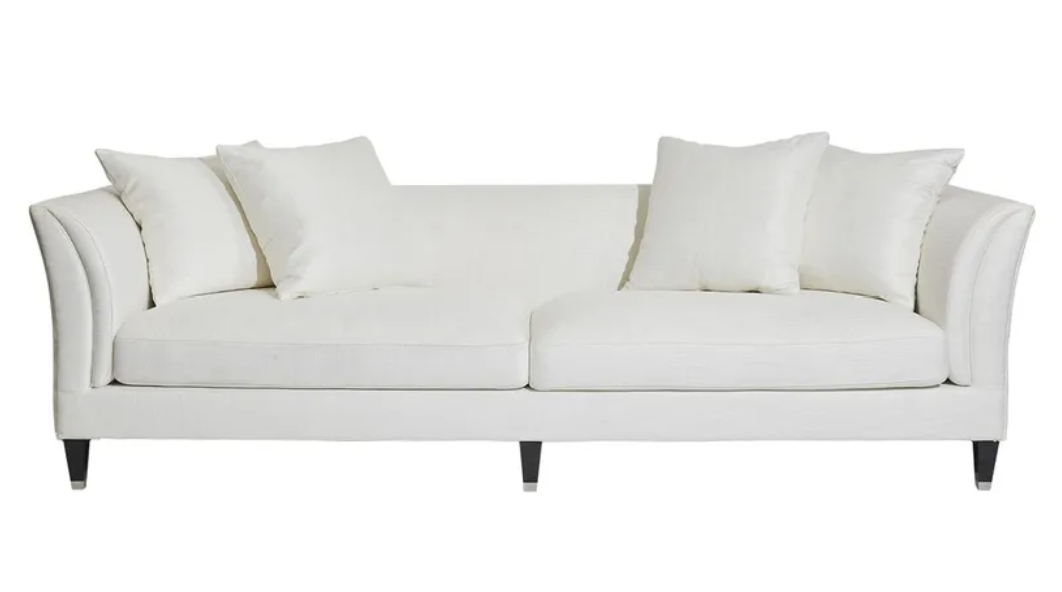 Bring sophistication and comfort to your living space with the Amalfi 3 Seater Sofa. This stylish upholstered sofa features a low-back sleek design of rounded wedge arms and superior feather and foam cushioning for unparalleled comfort. Crafted with a hardwood frame and inner spring suspension, and upholstered in ivory linen/viscose, this timeless piece is complete with silver capped timber legs. Front