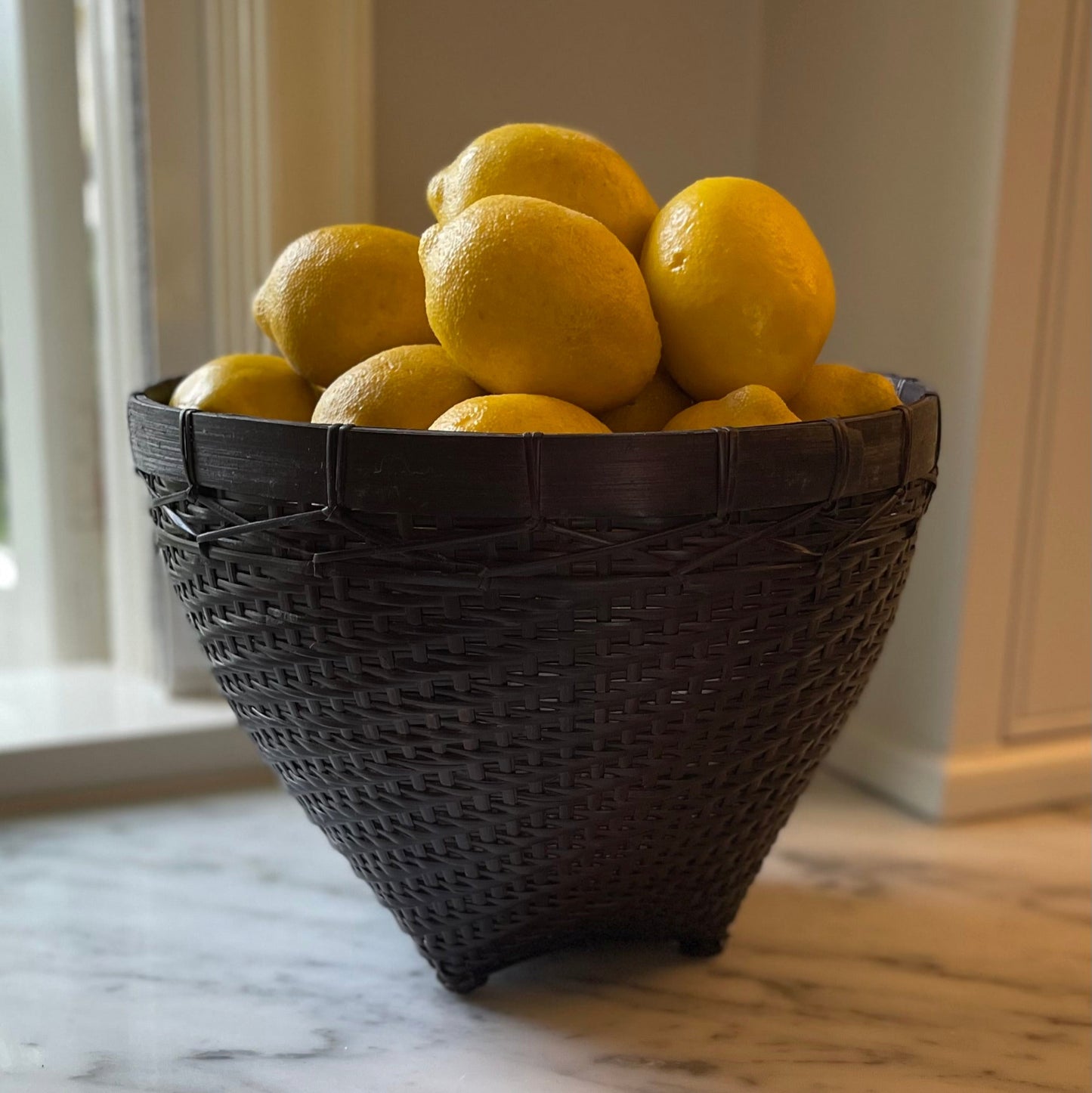 Our Banyu Handwoven Bamboo & Rattan Basket is crafted in East Indonesian Island Villages. These striking baskets can be used as an accent piece or to provide additional useful storage. Styled.