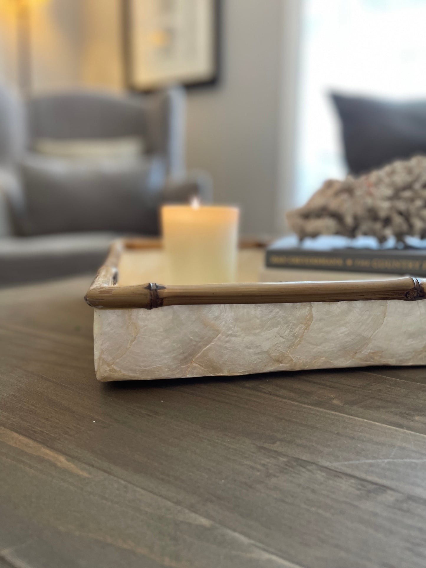 Our beautiful Capiz & Bamboo Charger Tray is sleek and elegant, easy to style on your console or coffee table. Corner