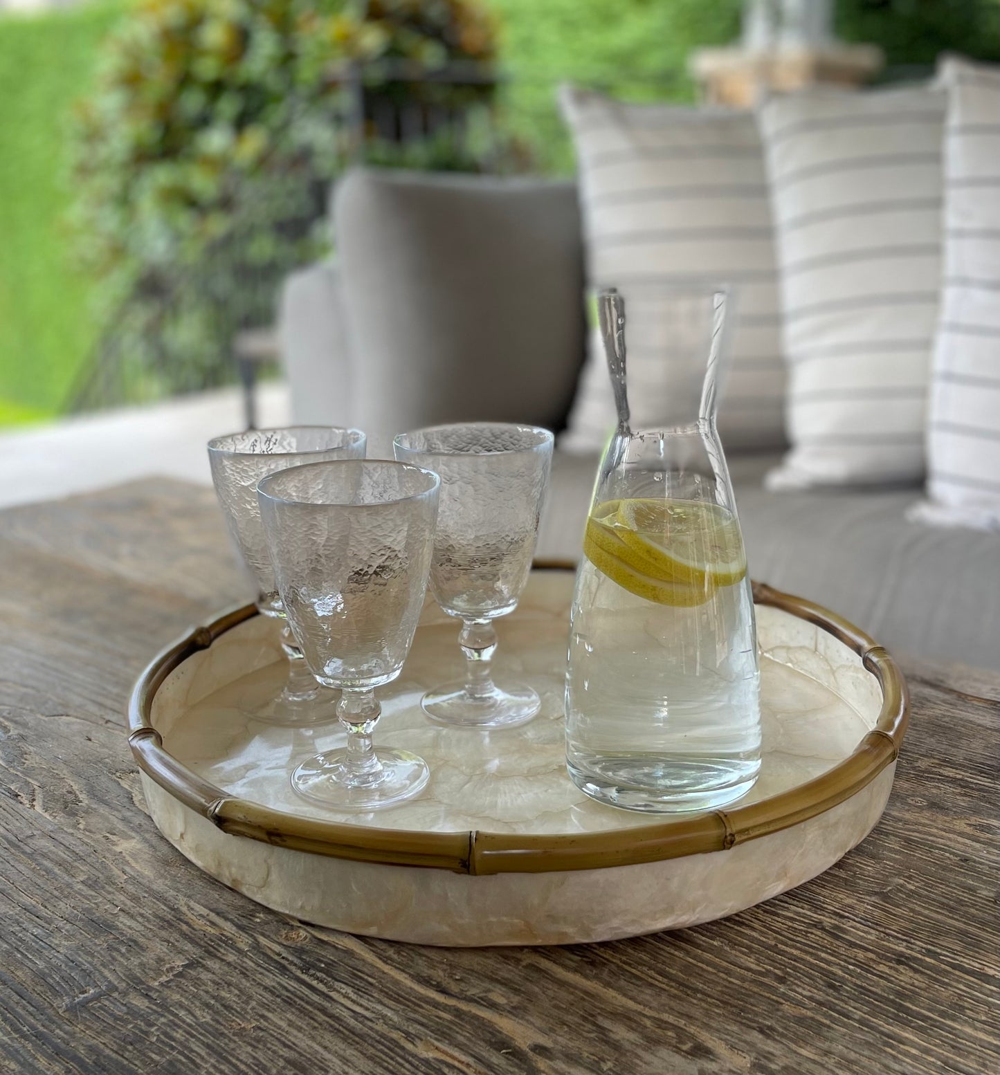 Our beautiful Capiz & Bamboo Round Tray is sleek and elegant, easy to style on your console or coffee table. Front