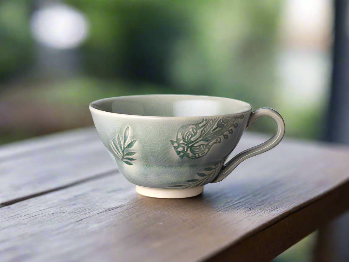 Generous in size and yet easy to hold. Wrap your hands around its beautiful shape and enjoy the pleasure of relaxing with your favourite brew! The cup is handmade in Portugal and made of white stoneware clay which is fired in extremely high temperatures making it very practical and durable.