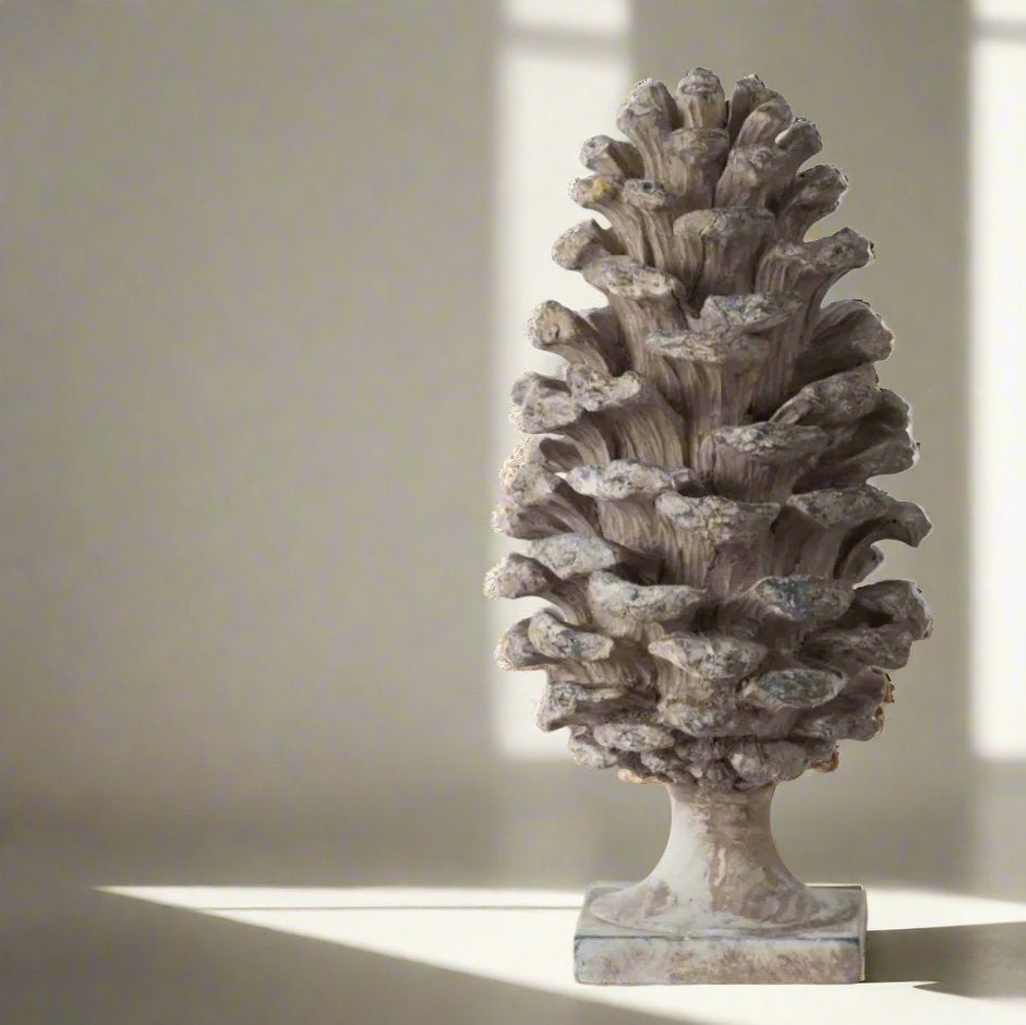 Transform any room into a cozy haven with this stunningly detailed Decorative Pine Cone . This versatile ornament boasts a soft grey taupe colour with a beautiful distressed, aged look that will complement any side table, console, bookcase, or mantle.