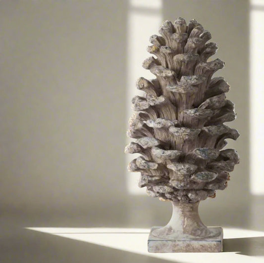 Transform any room into a cozy haven with this stunningly detailed Decorative Pine Cone . This versatile ornament boasts a soft grey taupe colour with a beautiful distressed, aged look that will complement any side table, console, bookcase, or mantle.