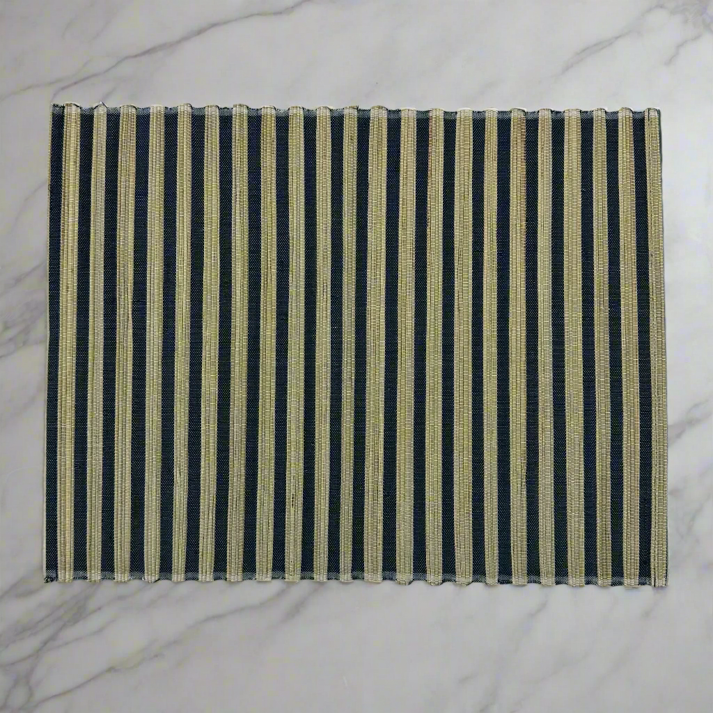 The Handwoven Diah Water Hyacinth Navy & Natural Striped Placemat - Set Of 4 are sure to elevate any table setting. Crafted from Water Hyacinth with a classic pattern, they can easily fit into many palettes, while providing protection to your tabletops.