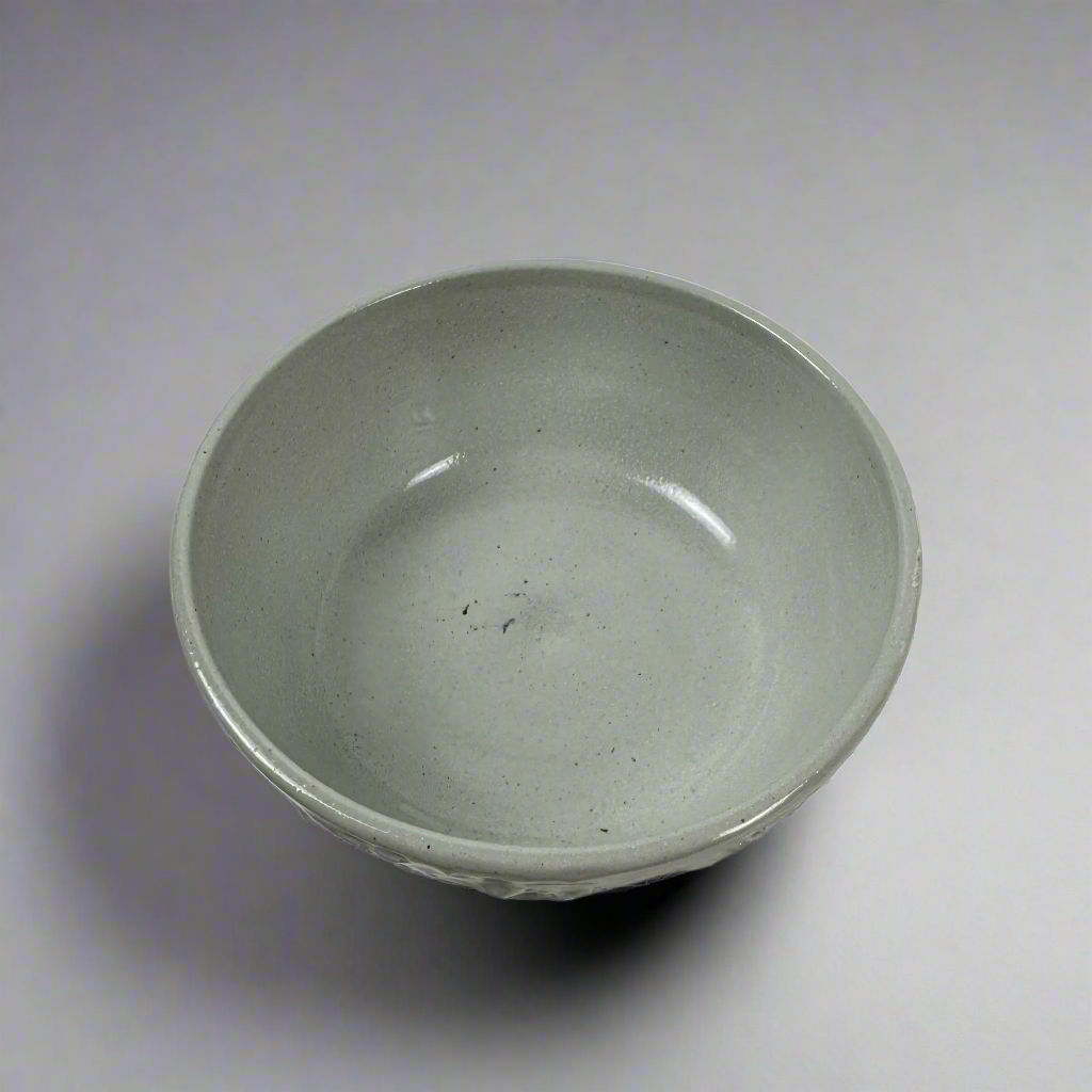 The Handcrafted Textured Enzo Bowl features calming neutral tones providing an attractive design that elevates the everyday to something unique and stylish. Top.