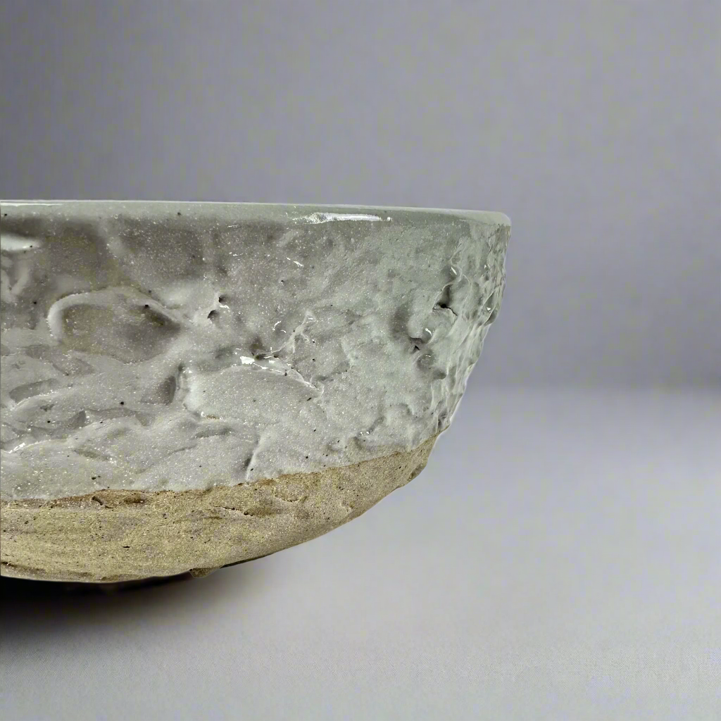 The Handcrafted Textured Enzo Bowl features calming neutral tones providing an attractive design that elevates the everyday to something unique and stylish. Detail.