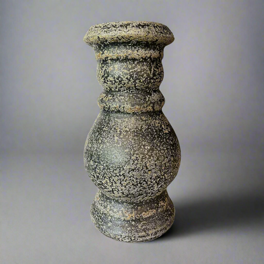 Crafted from terracotta, the chunky yet elegant Vergato Terracotta Candle Holder is substantial enough to work on its own or as a beautiful collection of candle holders on a mantelpiece or a table. Front.