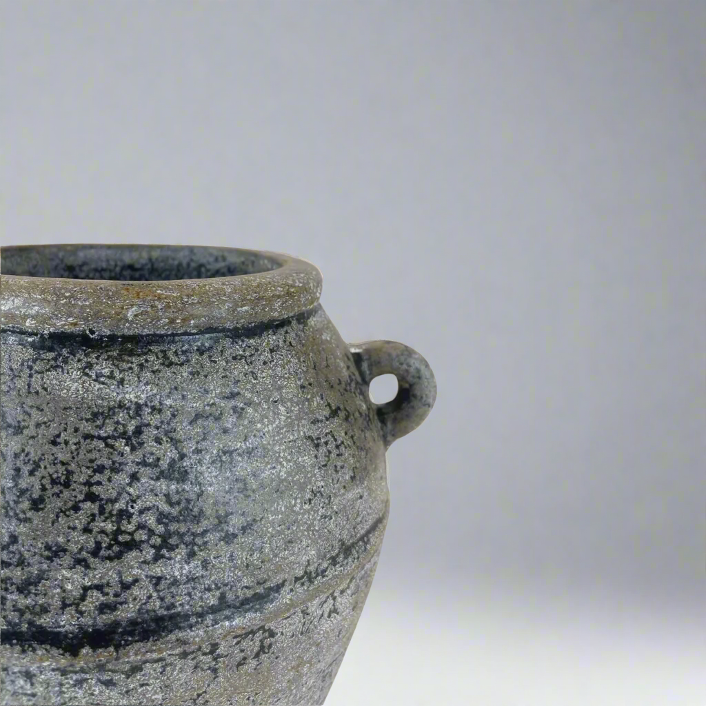 With a classic, traditional shape, this textured vase has a rustic pared-back look giving this decorative piece character.