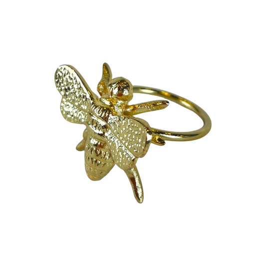 Add a touch of nature to your dining experience with the Brass Bee Napkin Ring. Made of solid brass, this delightful ring adds a touch of elegance to your table setting. Side detail.