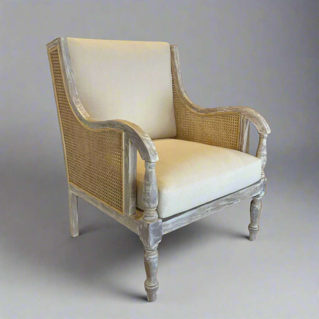 Crafted from teak and rattan, this very attractive and desireable elegant armchair with period features boasts a delicate distressed finish that lends it the patina of age. Front