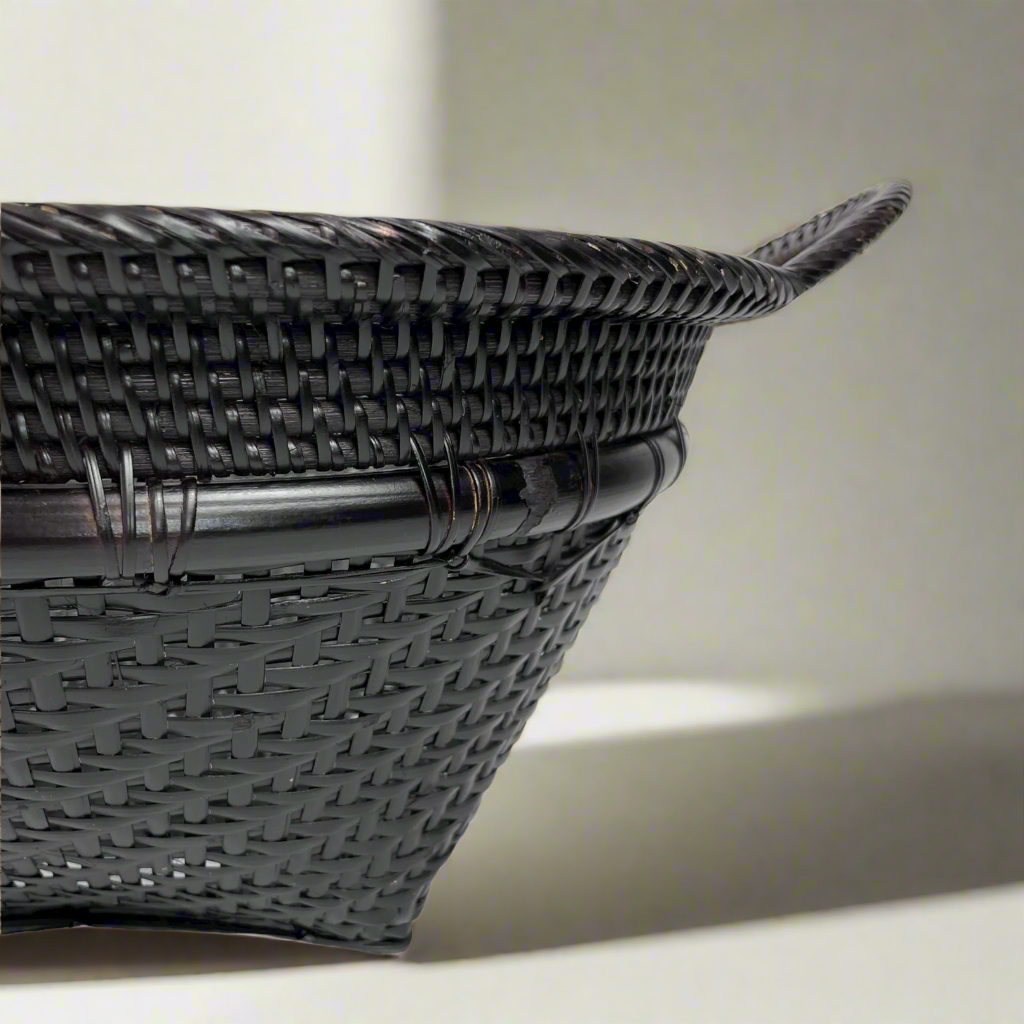 Crafted in remote East Indonesian Island Villages, the striking Basuki Handwoven Rattan & Bamboo Basket can be used as an accent piece or to provide additional useful storage. Close up.