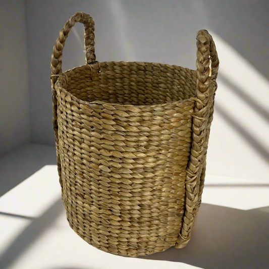 The Keranjang Water Hyacinth Basket is crafted from sustainable Water Hyacinth, bringing both practicality and beauty to your household. Whether for pantry storage or laundry, this basket has got you covered. Top view.