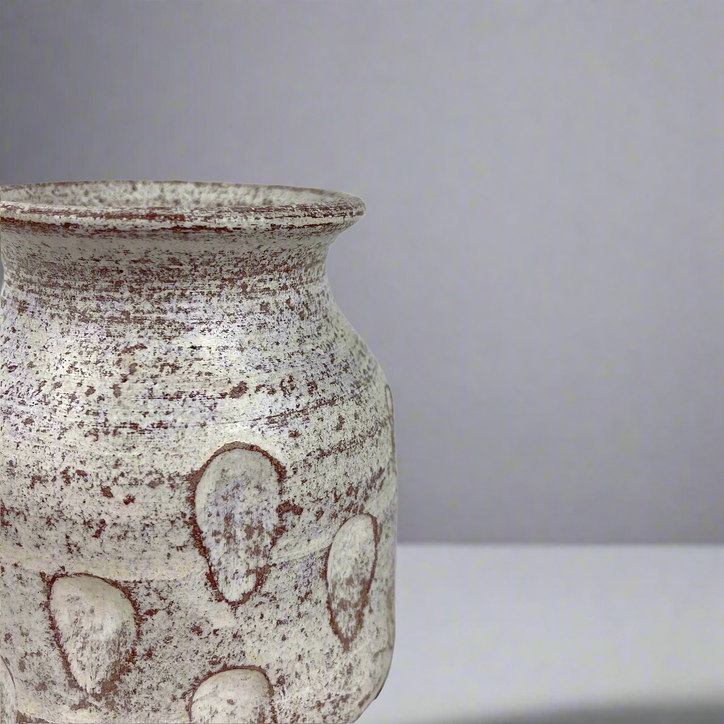 This beautiful rustic terracotta vase with neutral white tones makes it perfect for the bedroom, to place on a bedside table or as part of the living room decor. Corner