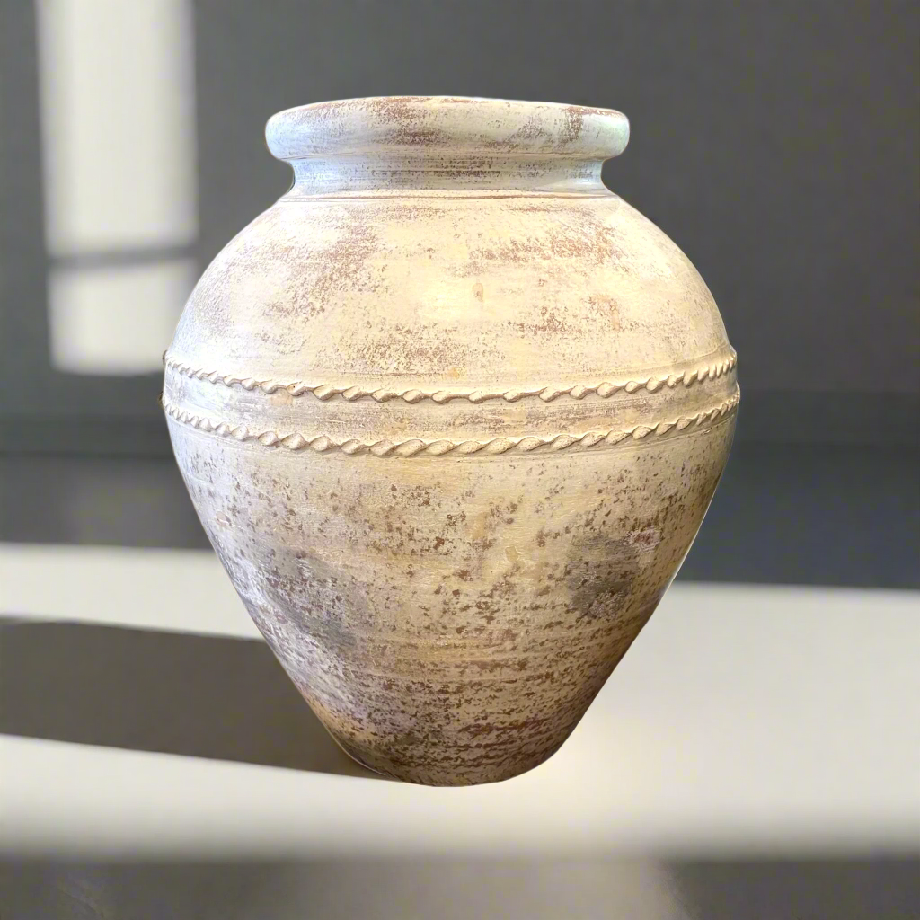 Expertly crafted and showcasing an eye-catching limewashed aged exterior, the Terracotta Pot is a stunning addition to any display, whether filled with florals or greenery or simply standing alone as a statement piece.