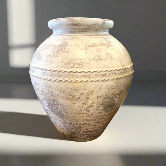 Expertly crafted and showcasing an eye-catching limewashed aged exterior, the Terracotta Pot is a stunning addition to any display, whether filled with florals or greenery or simply standing alone as a statement piece.