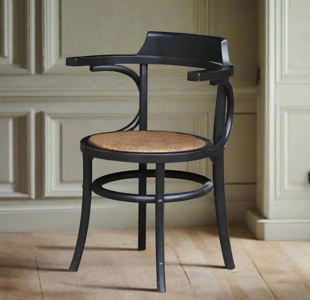 The Louis Chair is a stylish and versatile piece, crafted from oak with a striking black frame and natural rattan seat. Its elegant yet modern design is perfect for adding a touch of style to any home, creating timeless appeal. Front