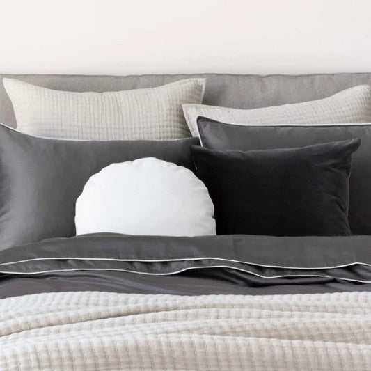 Maddox Silver European Pillowcases are an exquisite choice for luxury bedding. Crafted with 100% cotton voile and hand-embroidered with a Kantha stitch detail, this European pillowcase provides a sophisticated and plush aesthetic. Its 65cm x 65cm dimensions and tie closure on reverse make it an ideal addition to any bedroom. Styled.