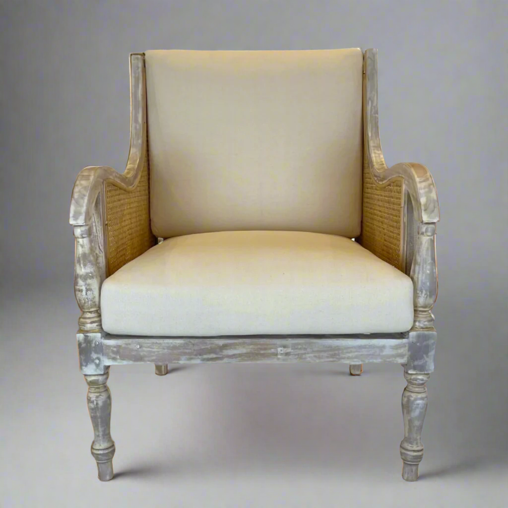 Crafted from teak and rattan, this very attractive and desireable elegant armchair with period features boasts a delicate distressed finish that lends it the patina of age. Front
