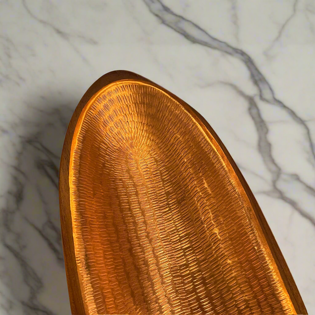 Artfully crafted, our Tembaga Bowls lend just the right amount of texture and dimension to your space. Formed entirely from teak and lined with copper these bowls are sure to catch the eye wherever they’re placed.