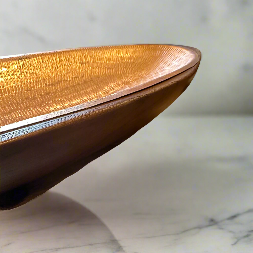 Artfully crafted, our Tembaga Bowls lend just the right amount of texture and dimension to your space. Formed entirely from teak and lined with copper these bowls are sure to catch the eye wherever they’re placed.