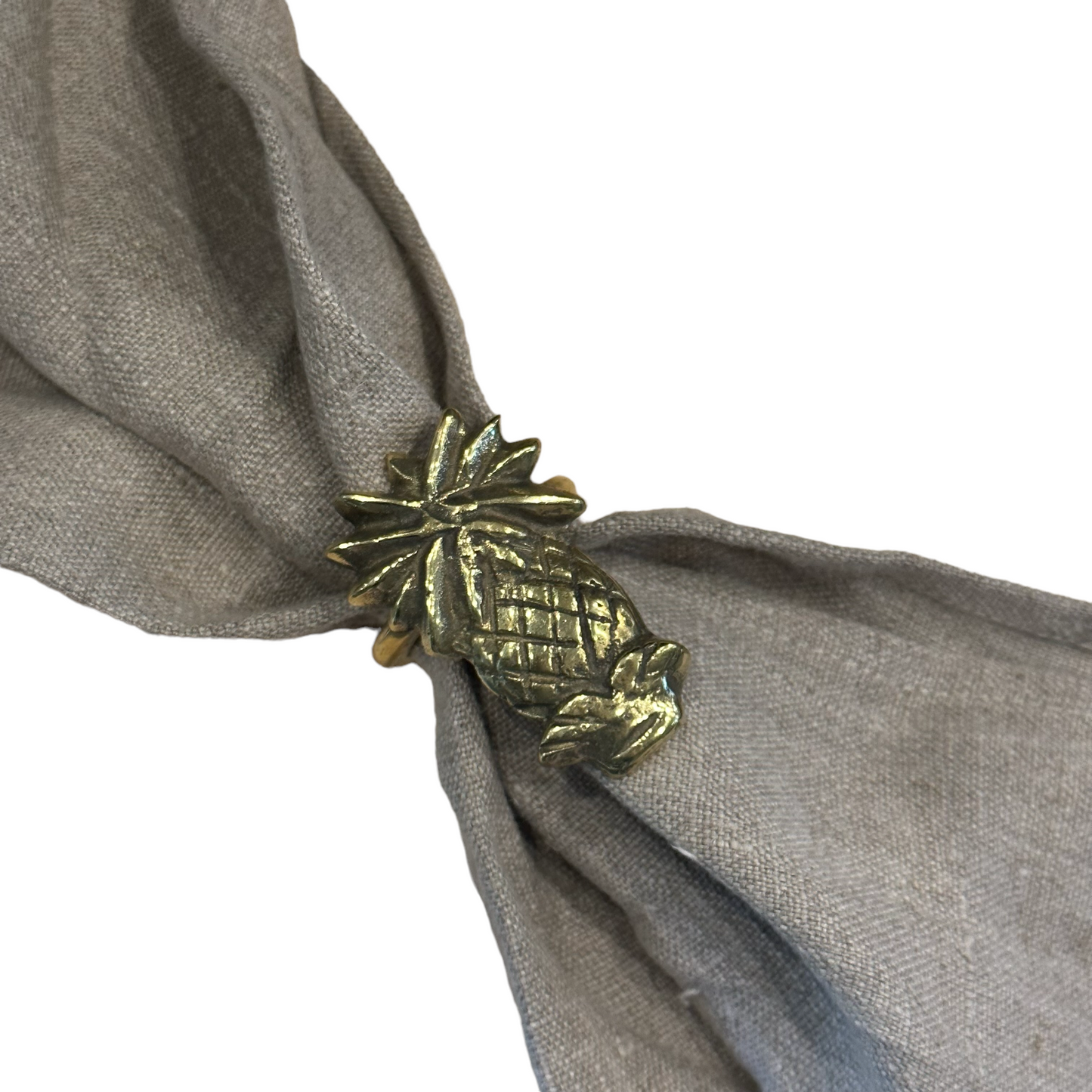 Our solid brass napkin ring. Featuring a fun Pineapple design. The perfect addition to your dining table setting. Front