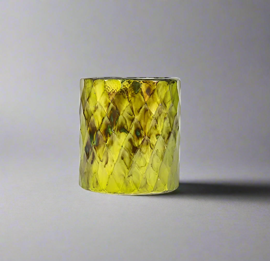 This individual piece is blown by hand with barfi cut glass detailing in lime oxidised tones. Use this hurricane as a candleholder around the home to add warmth and luxury.