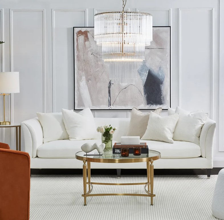 Bring sophistication and comfort to your living space with the Amalfi 3 Seater Sofa. This stylish upholstered sofa features a low-back sleek design of rounded wedge arms and superior feather and foam cushioning for unparalleled comfort. Crafted with a hardwood frame and inner spring suspension, and upholstered in ivory linen/viscose, this timeless piece is complete with silver capped timber legs. Front