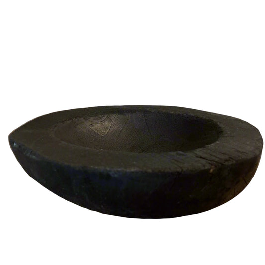 Indulge in the perfect combination of organic and airy design with our exquisite Handcarved Api Teak Burned Bowl. Crafted from the teak tree's root and expertly finished with a unique burning method, resulting in a striking deep black hue.