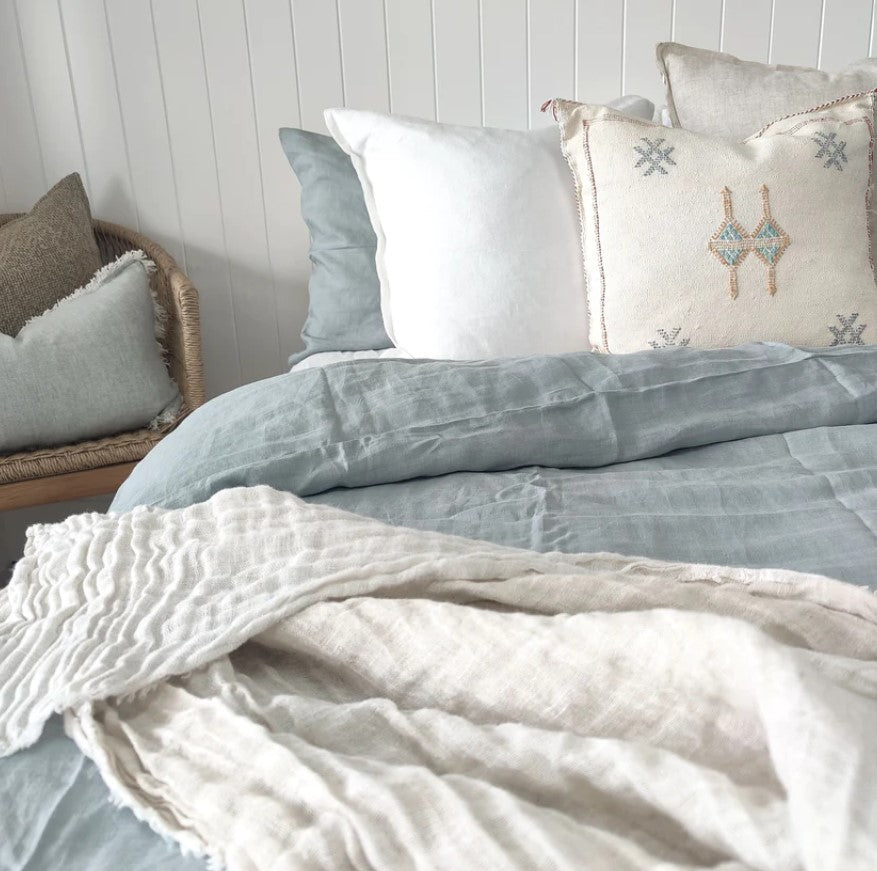 The Juliet Pure French Linen Duvet Cover Set brings a relaxed yet elevated look to your bedding. Crafted from 100% French linen which is hypo-allergenic & highly breathable, this elegant duvet cover showcases charming shell buttons at the end. Close up.