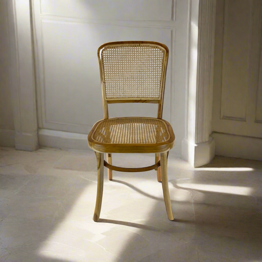 Crafted with high-quality teak wood and rattan, the Kursi Chair has a traditional form that feels warm and welcoming and is also extremely comfortable. Front