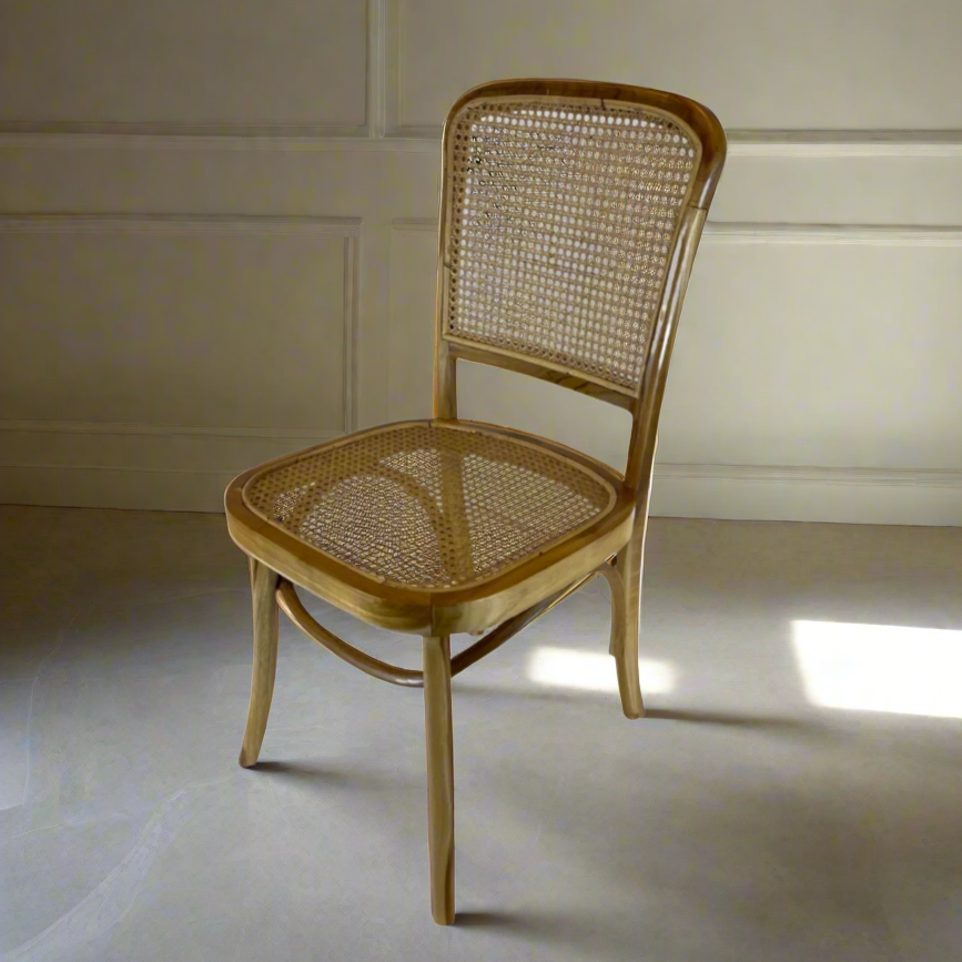 Crafted with high-quality teak wood and rattan, the Kursi Chair has a traditional form that feels warm and welcoming and is also extremely comfortable. Front