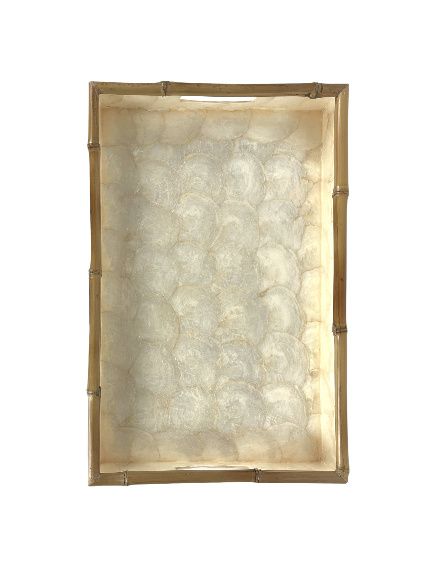 Crafted by skilled artisans in Southeast Asia, our Rectangle Capiz and Bamboo Tray adds a touch of elegance to any interior. Its sleek design and versatile size make it perfect for styling on consoles, coffee tables, or even in the bathroom. The soft tones of Capiz and the natural bamboo edge combine to create a unique and beautiful addition to any space. top