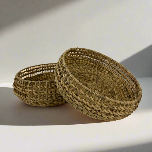 Inspired by the delicate structure of water hyacinth, the Kirana Water Hyacinth Woven Bowl has a wide weave that is relaxed and organic to suit a range of styles and homes. Styled.