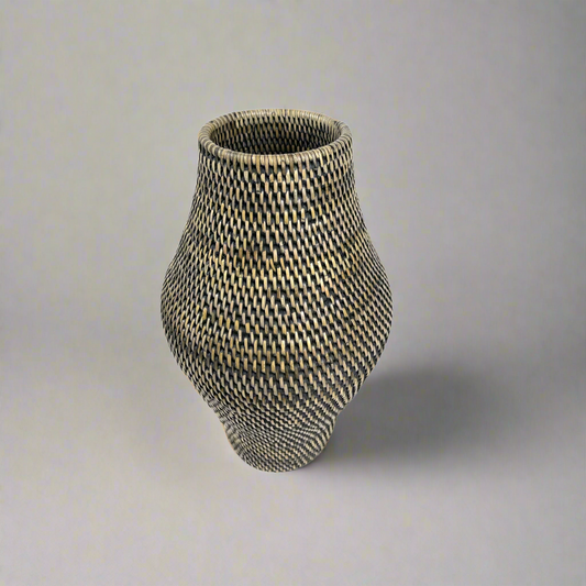 Handwoven from natural Rattan, the Mentari Vase adds a shapely presence to your home while adding an abundance of natural texture.